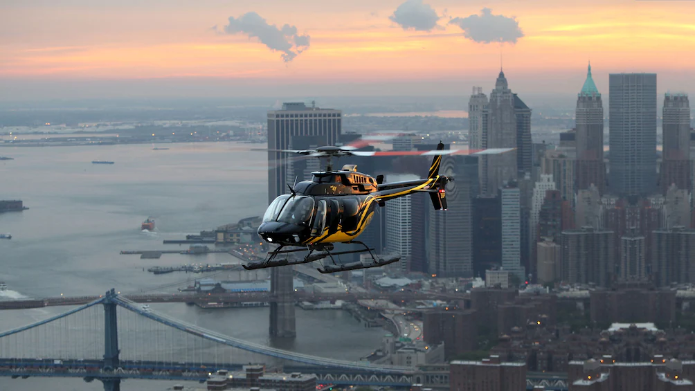 Colorful Helicopter Flying Over Manhattan at Dusk