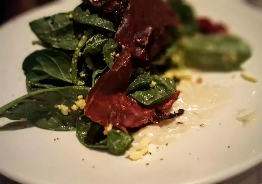 Salad plate of fresh greens and dressing at Il Corso in New York
