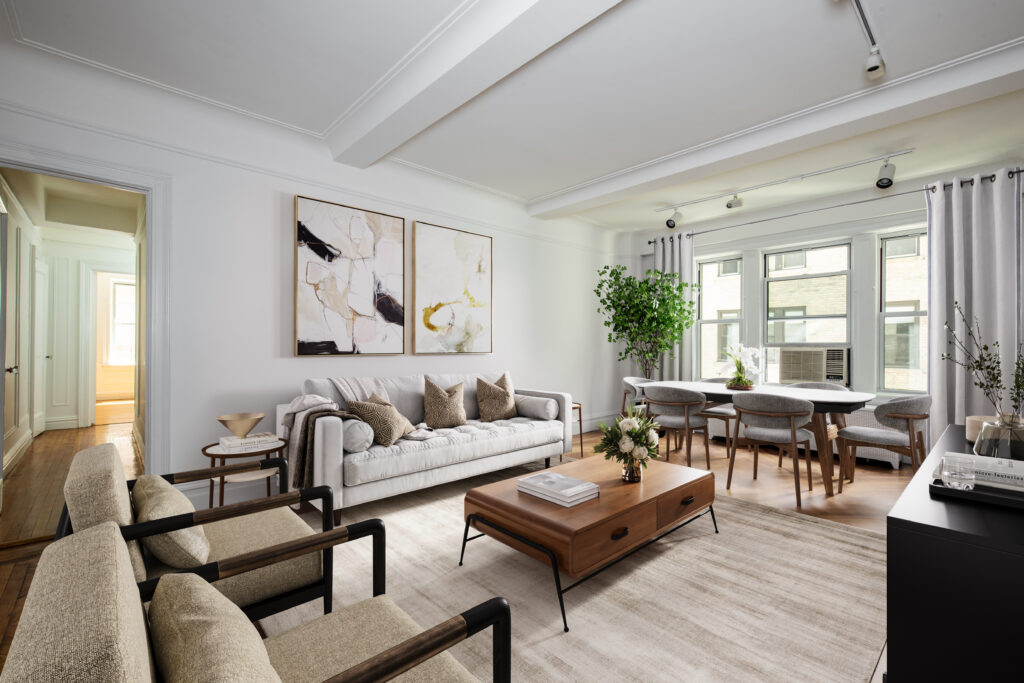 Stylish and modern living area in an Upper West Side condo, featuring elegant decor and ample natural light.
