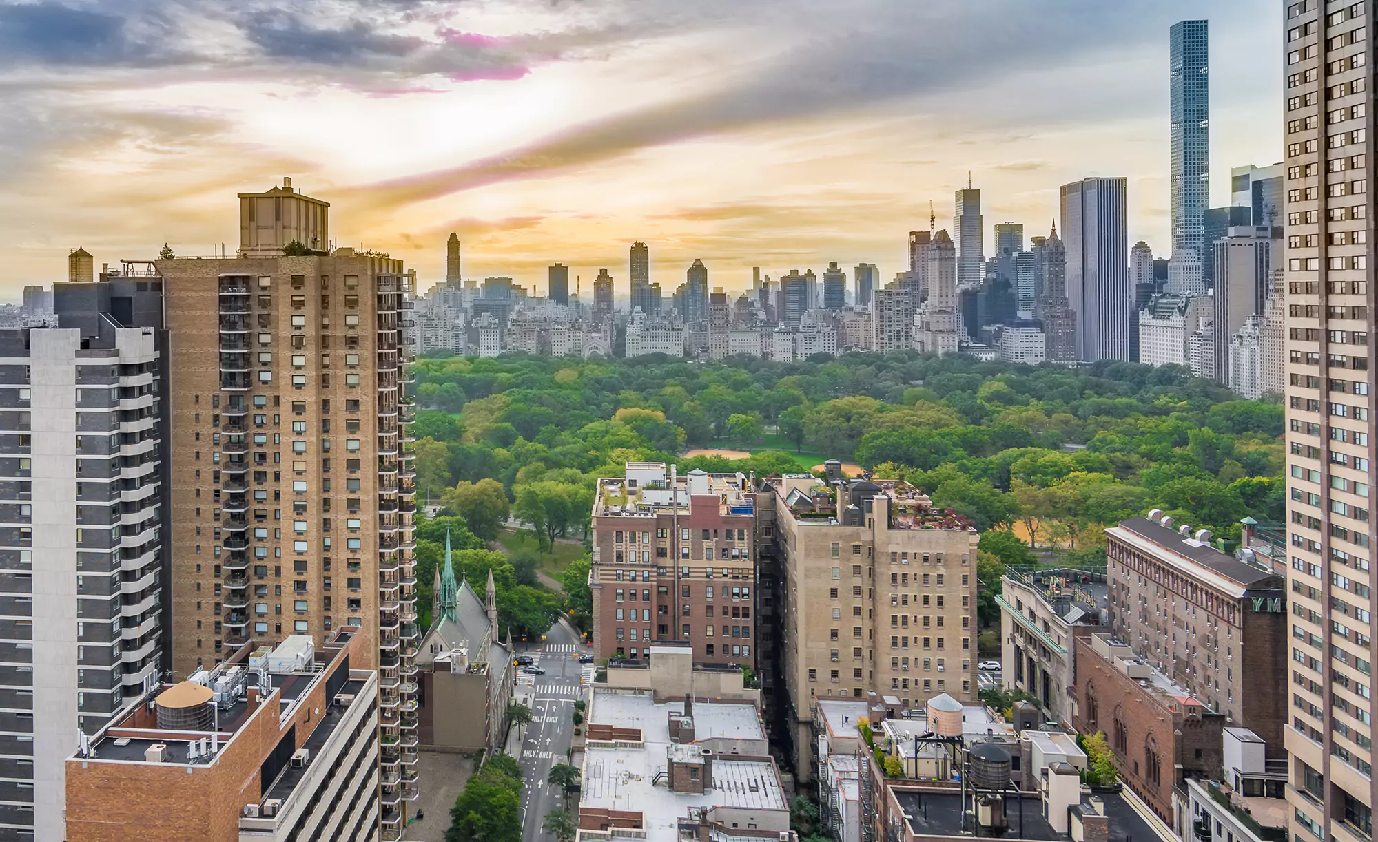 Aerial View of Manhattan Skyline, Skyrise Buildings, Central Park and Luxury Real Estate Market at Sunset