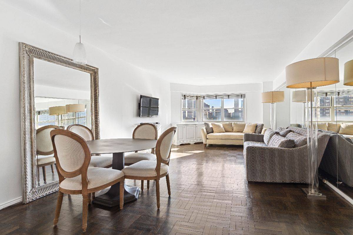 Spacious living room witha table and sofa on 35 Park Ave #18F